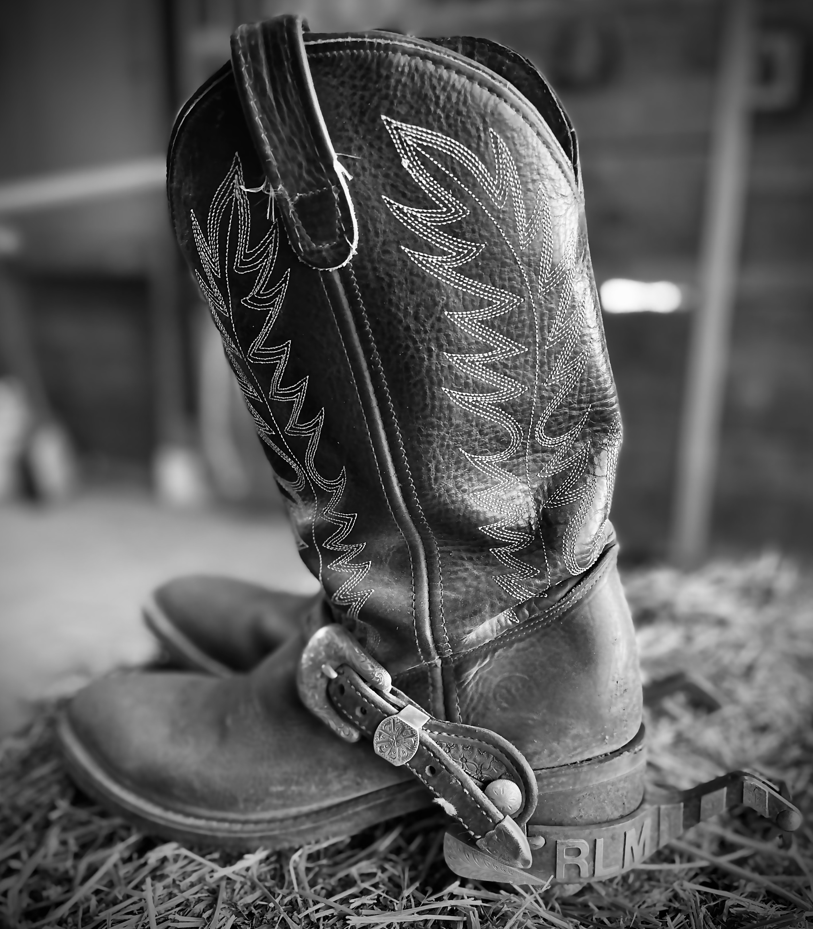 Cowboy boots and spurs on hay — working ranch life at Lassen Ranch